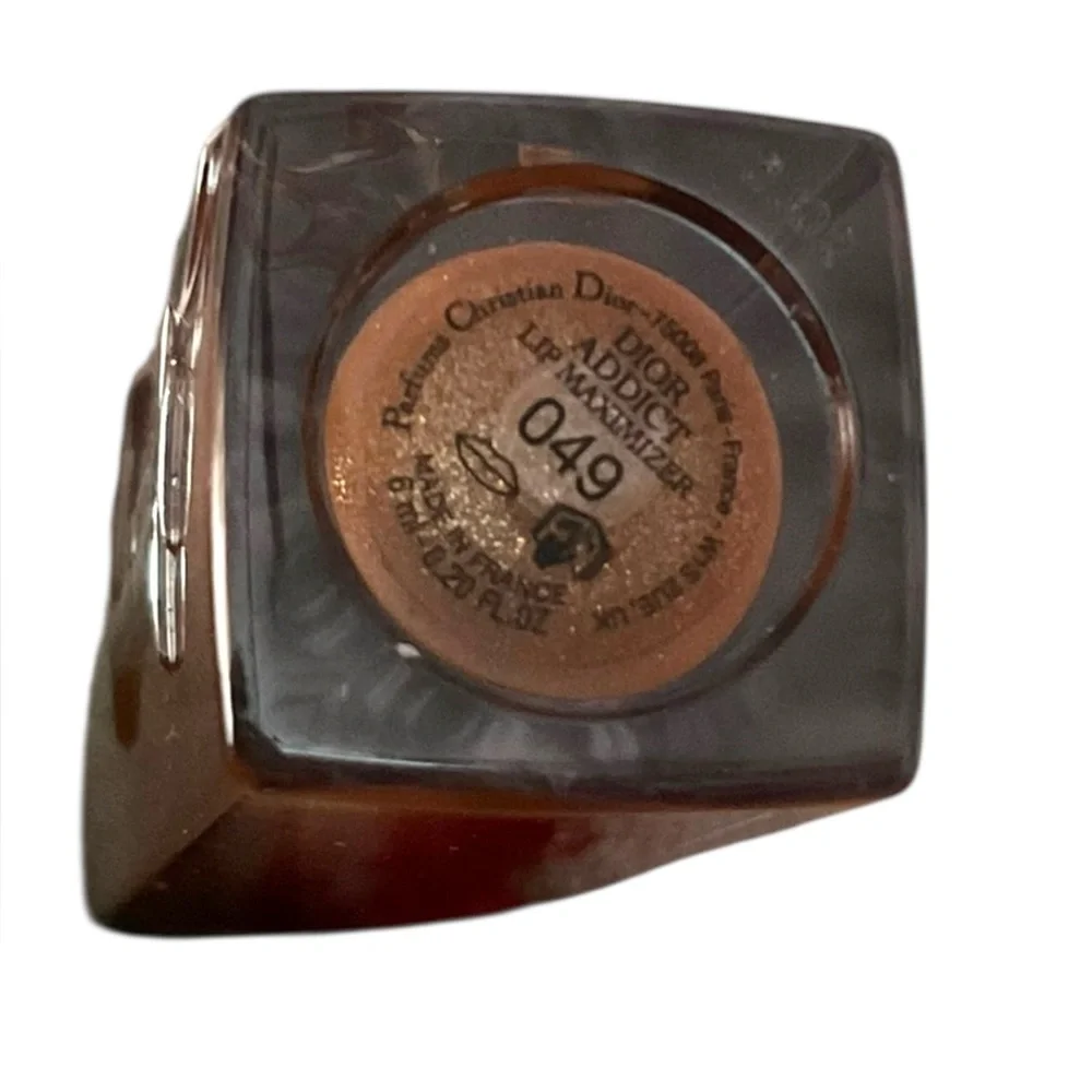 Dior Addict Lip Maximizer Plumping Gloss, likely in the shade 049 Pure Copper